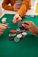 Free photo friends playing poker together