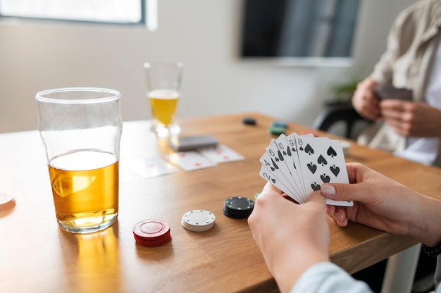 Free photo friends playing poker together