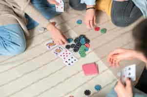 Free photo friends playing poker together