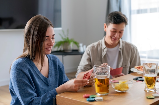 Free photo friends playing poker together