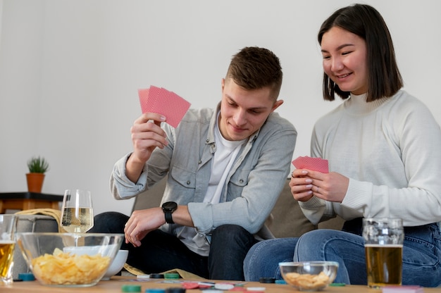 Free photo friends playing poker together