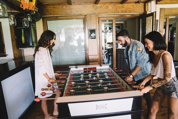 Friends playing table football