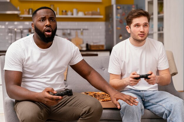 Friends playing video games on tv