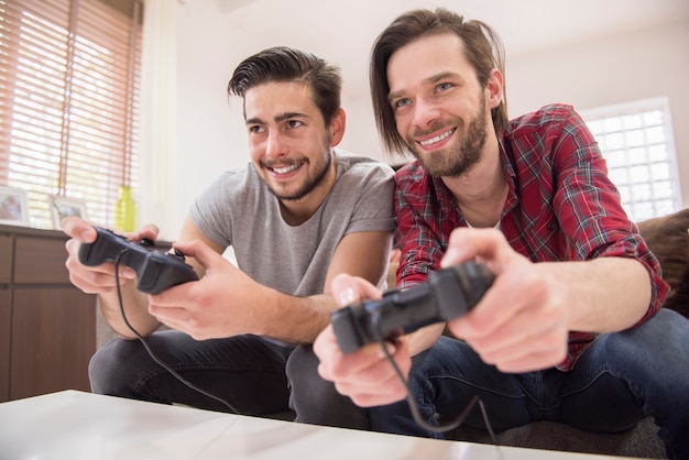 Friends playing videogames