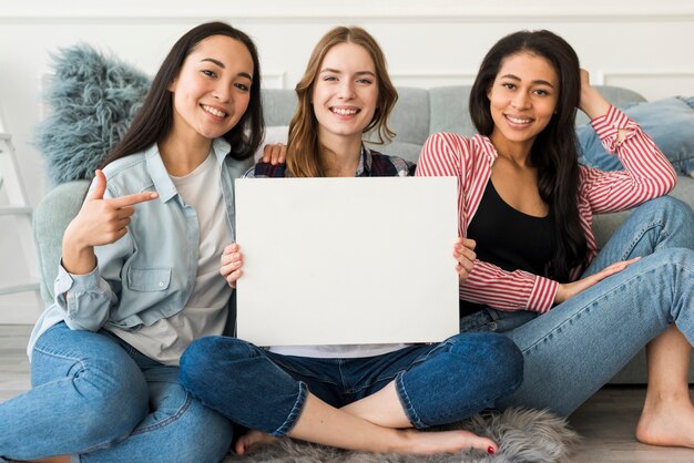 Friends pointing at blank paper