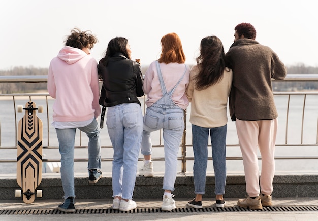 Friends posing together back view