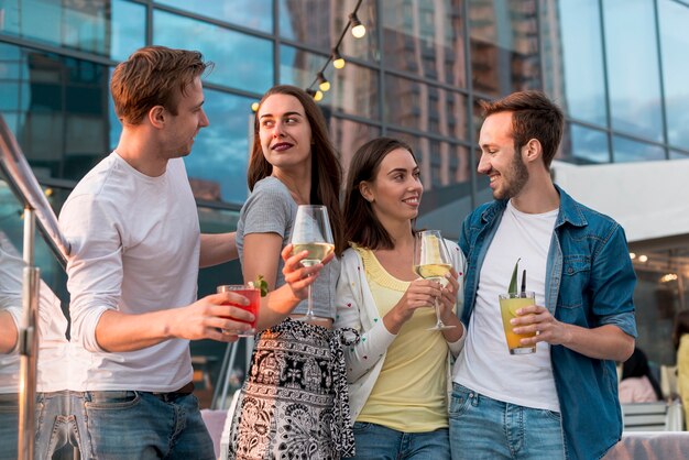 Friends posing with drinks