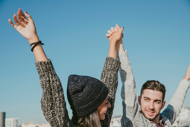 Friends raising arms