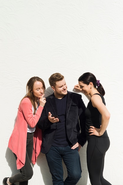 Friends relaxing together on white background