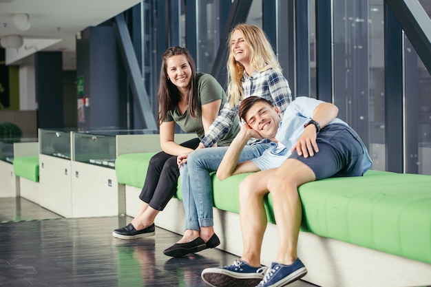 Friends resting on sofa