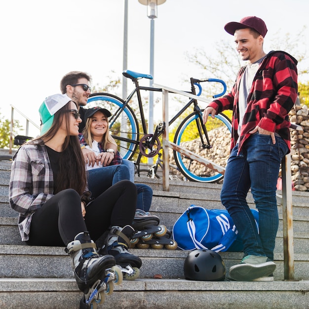 Friends resting on stairs after ride