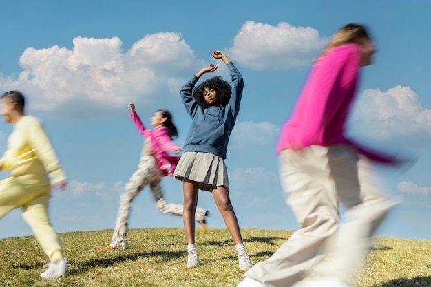 Friends running around together on a field outdoors