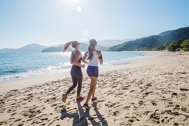 Friends running under the sun