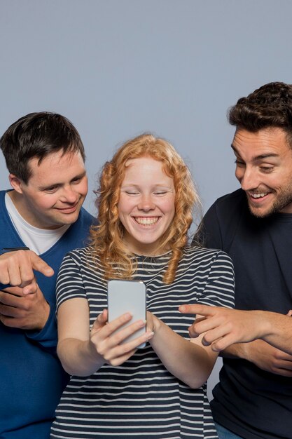 Friends seeing something funny on a phone