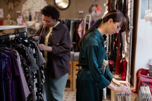 Friends shopping in second hand market