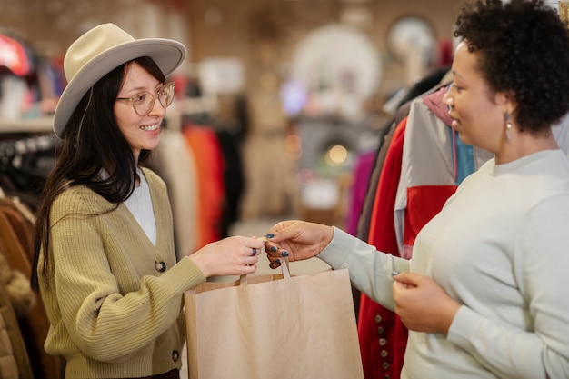 Free photo friends shopping in second hand market