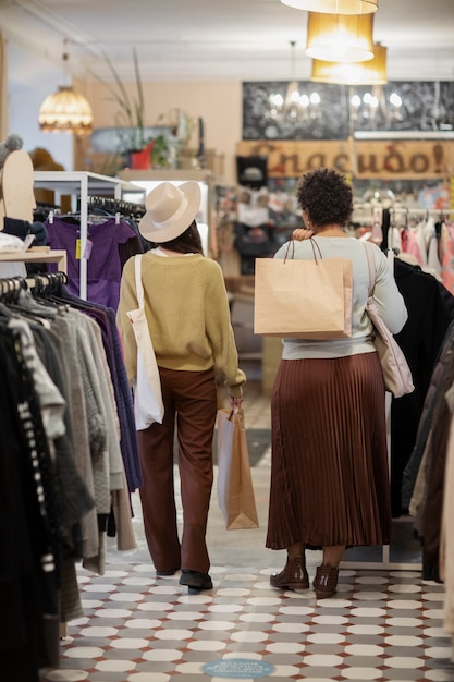 Friends shopping in second hand market