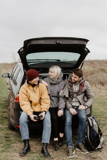 Free photo friends sitting in back of car