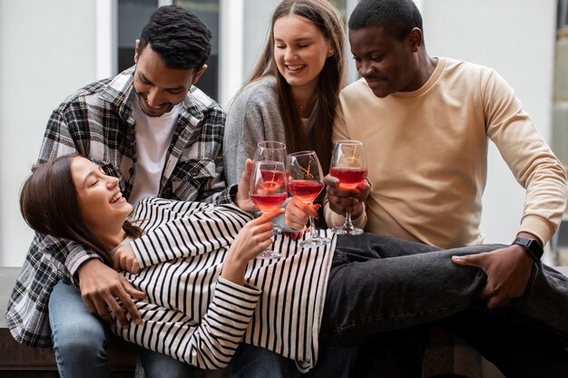 Friends smiling and holding drinks