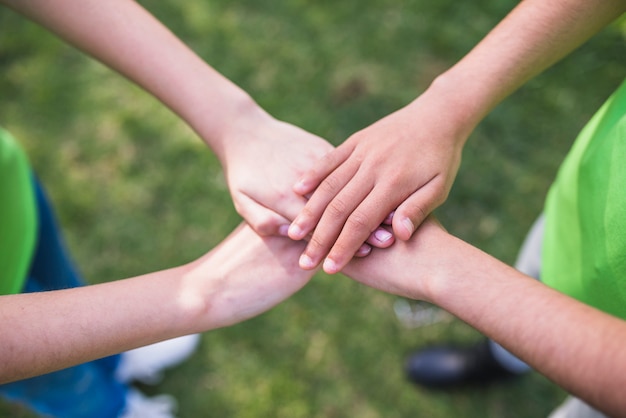 Free photo friends stacking their hands together