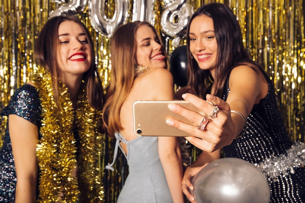 Friends taking selfie on new year celebration