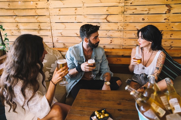 Friends talking and drinking