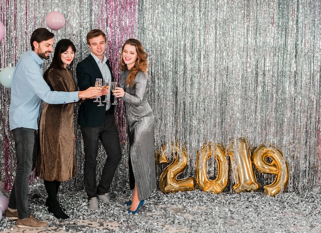 Free photo friends toasting new year party