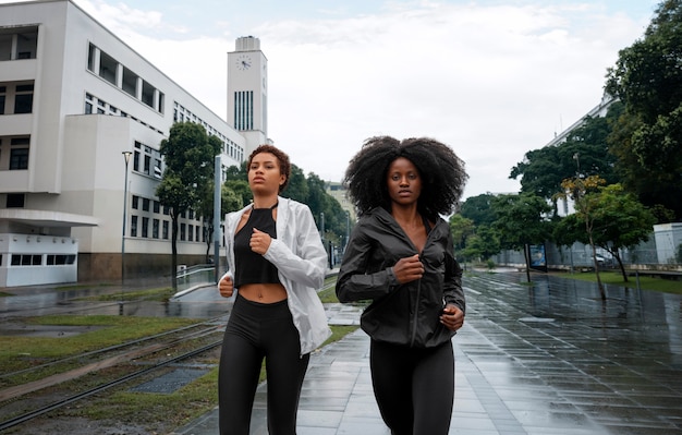 Friends training  together outdoors