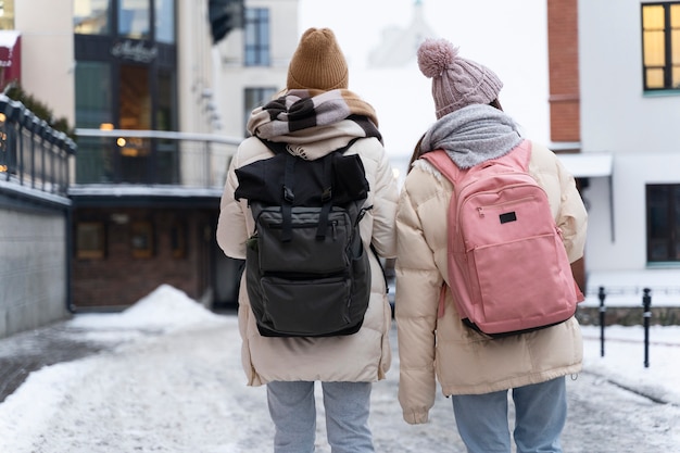 Free photo friends traveling together in winter time