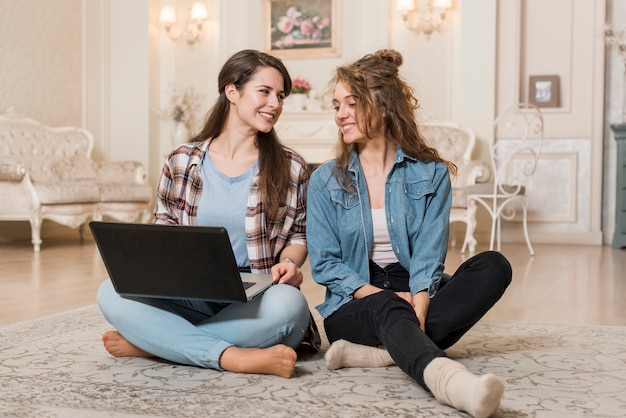 Friends using laptop