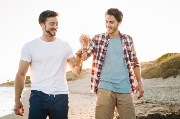 Friends walking at the beach