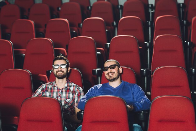Friends watching film in cinema