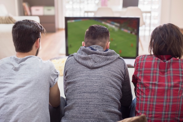 Friends watching football match