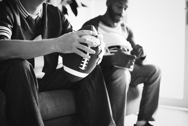 Friends watching sports in the living room