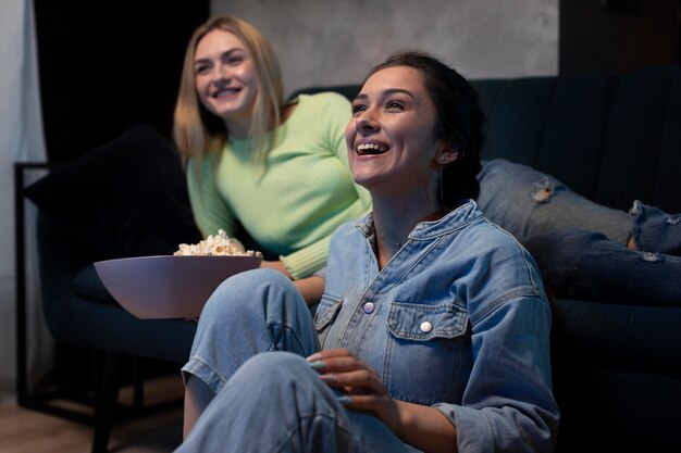 Friends watching streaming service together in the living room