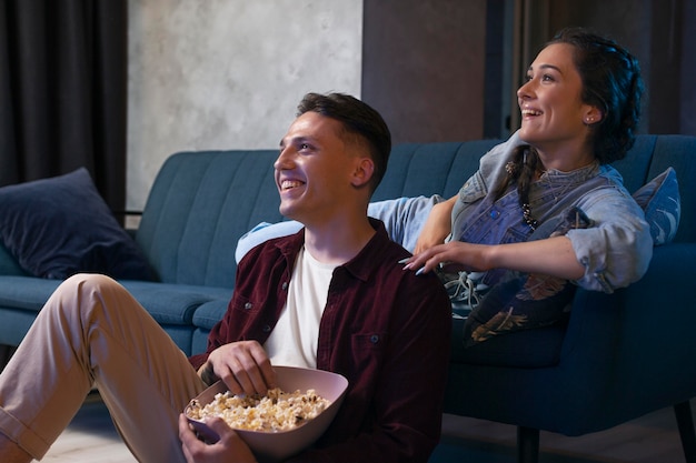 Friends watching streaming service  together in the living room