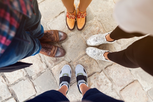 friends wearing different shoes