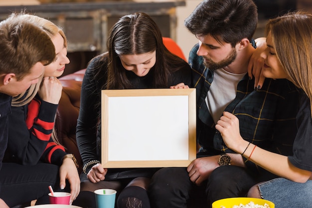 Friends with whiteboard at a party