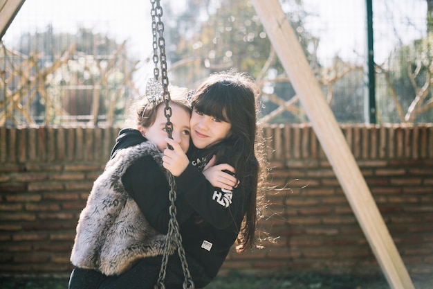 Friendship concept of two girls on playground