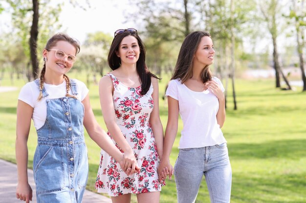 Friendship. Women in park during the day