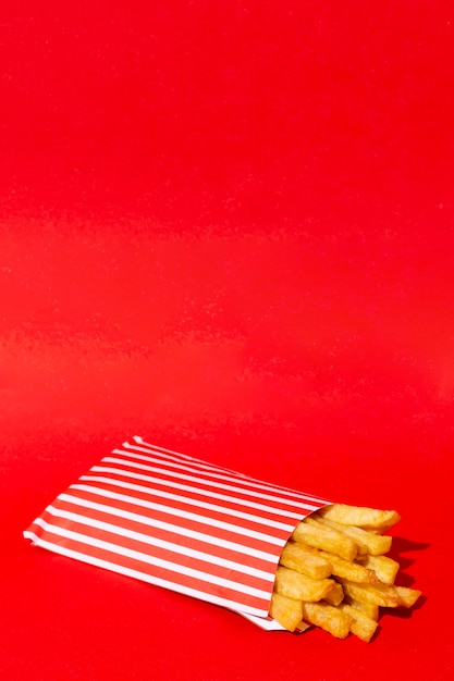 Fries on red background