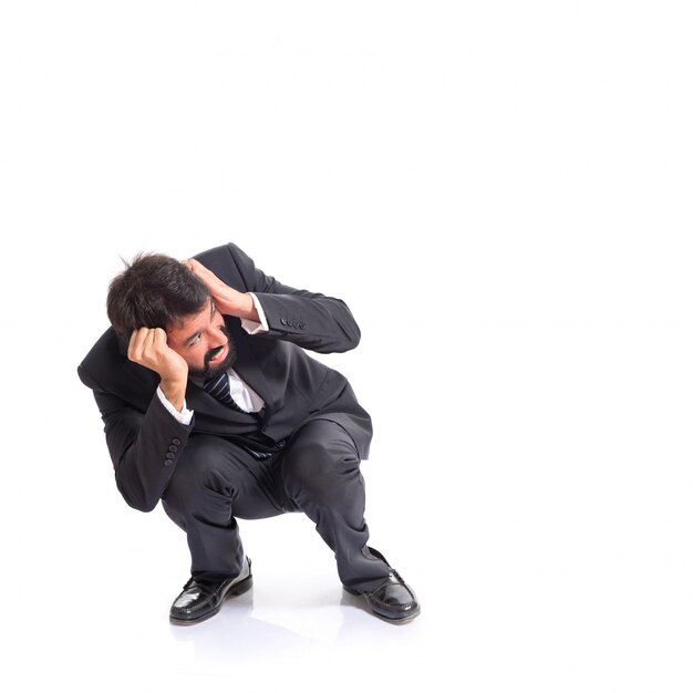 Frightened businessman over isolated white background