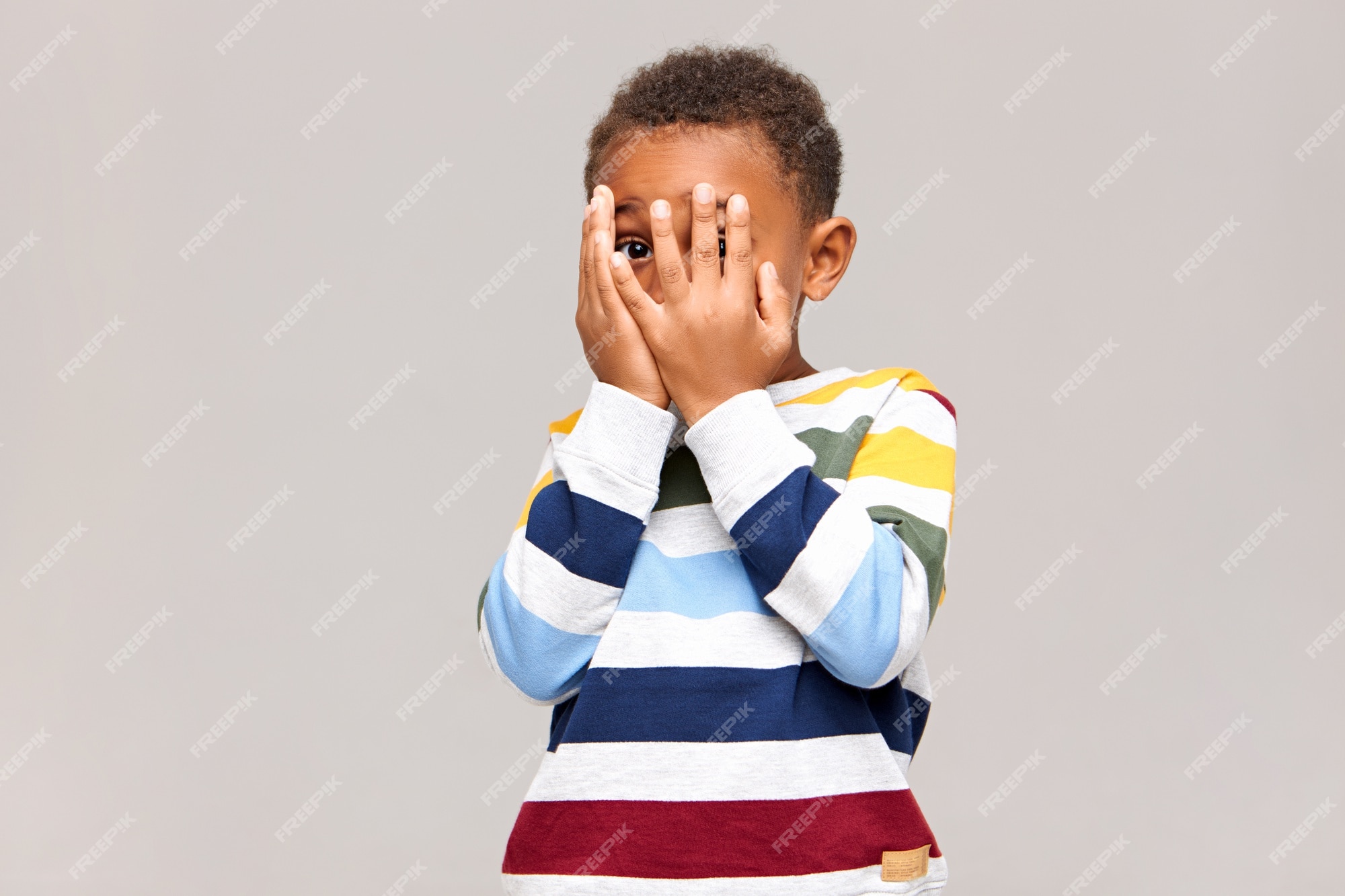 Scared Young Boy with Hands on His Face Stock Photo - Image of