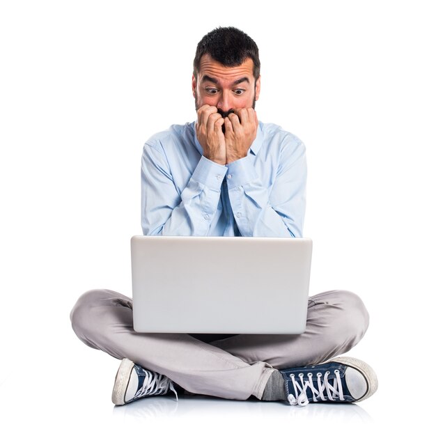 Frightened man with laptop