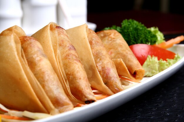 Fritters with meal and vegetables