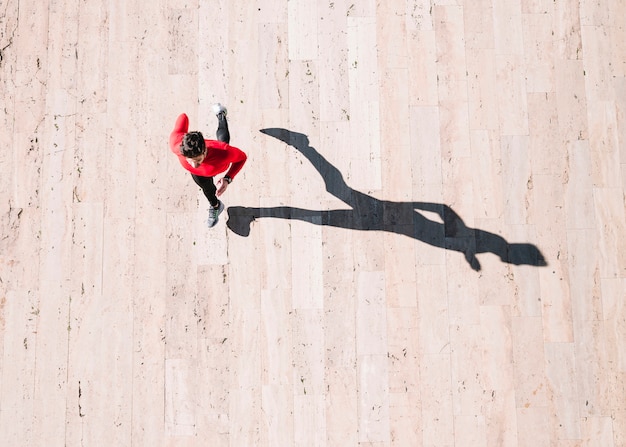 Free photo from above athlete running on pavement