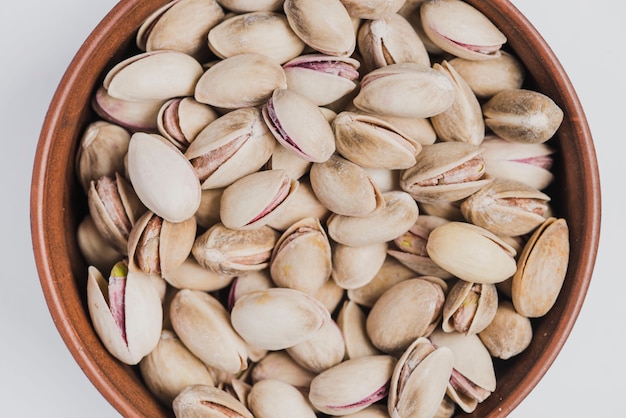 Free photo from above bowl with pistachios