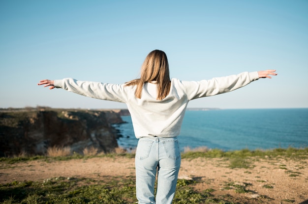 From behind girl and the ocean