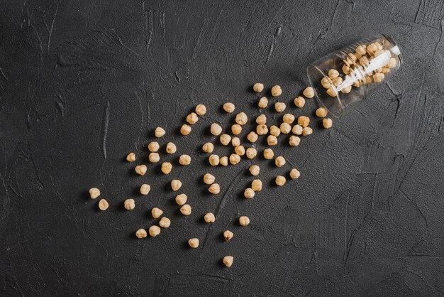 From above hazelnuts spilled from glass