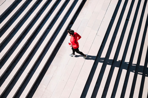 Free photo from above man running on stairs